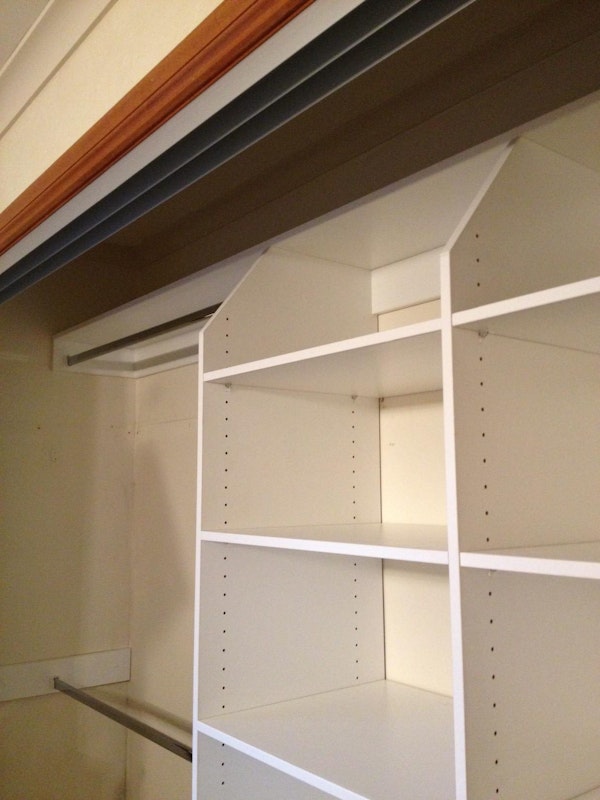 Detail showing splayed top shelf access