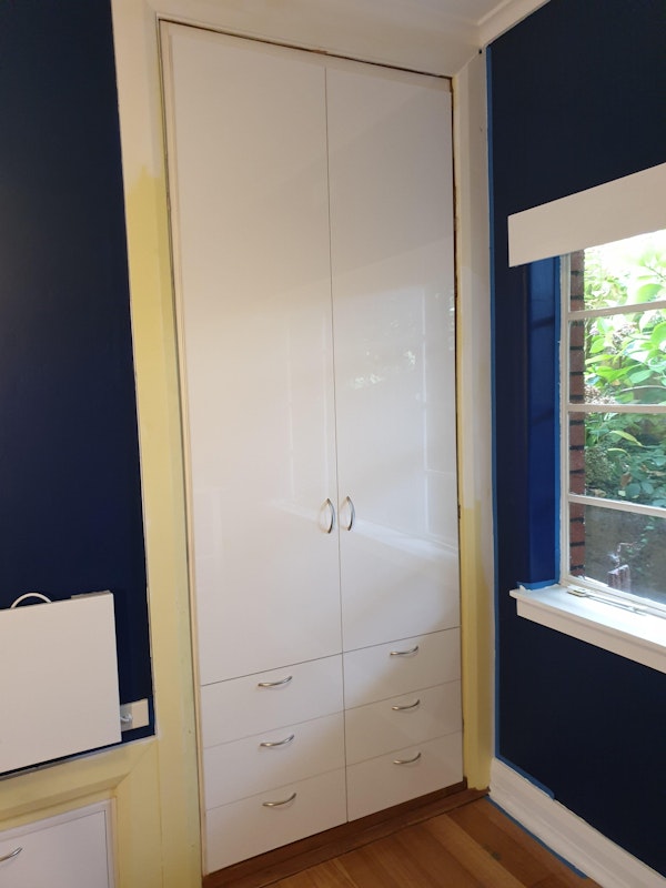 White Gloss swing doors with exposed drawers below